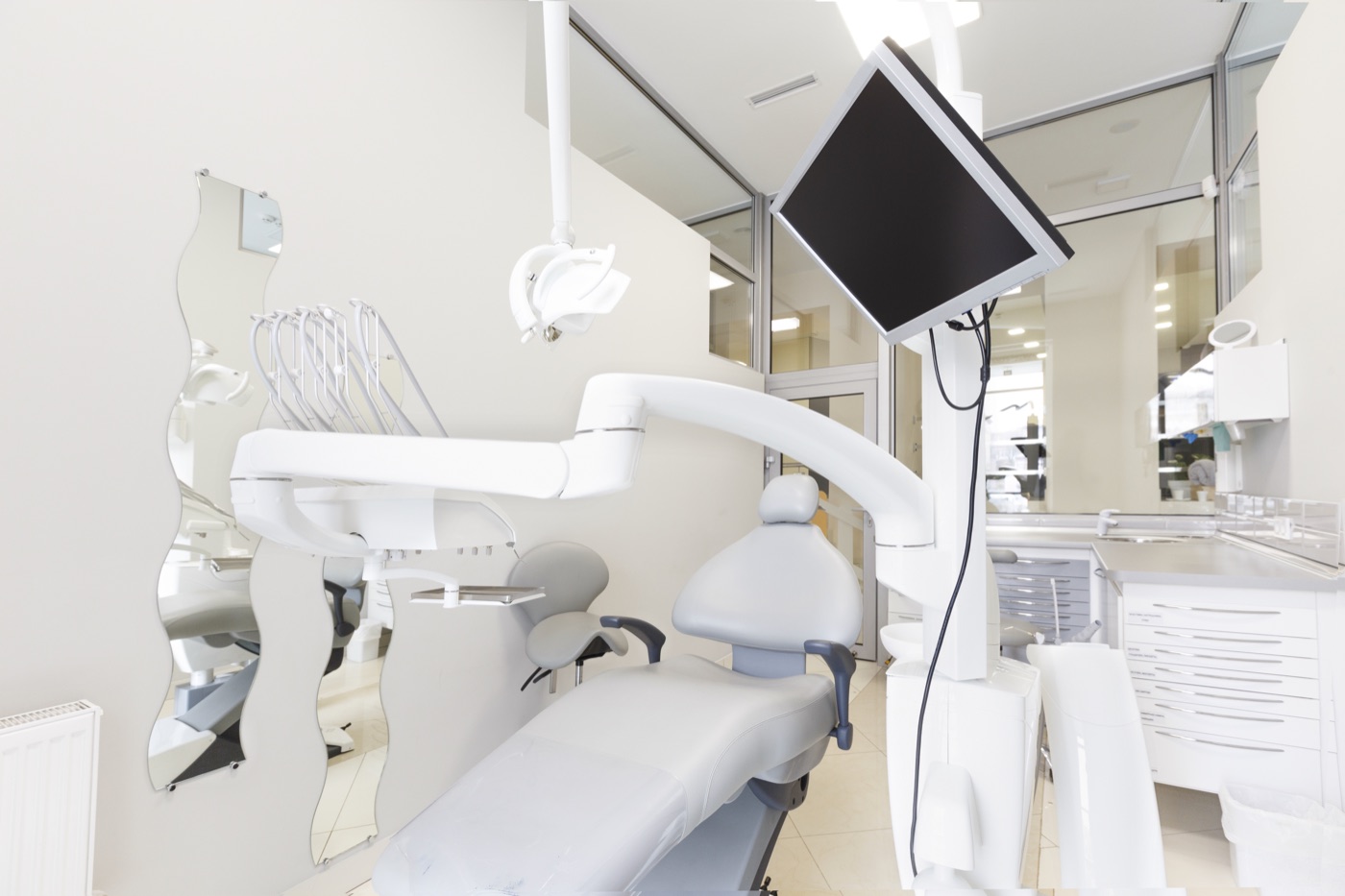 Modern all-white dental operatory